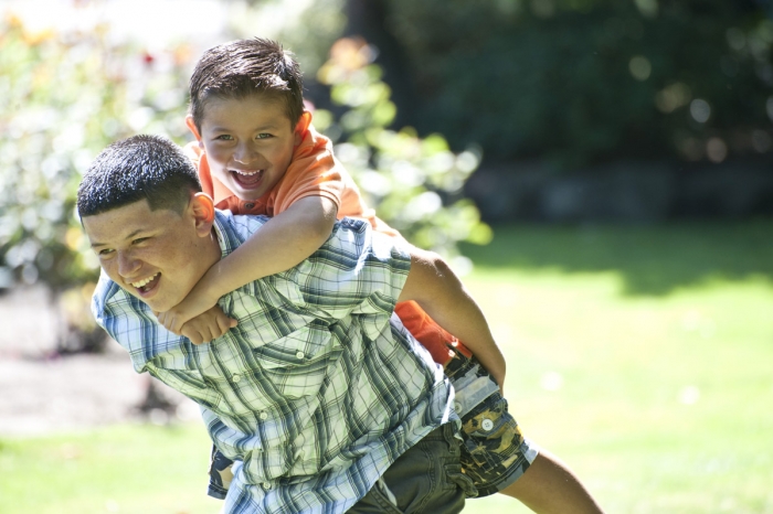 Happy brothers, older carrying younger | Multicare | Western Washington
